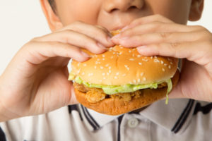 boy eating a burger