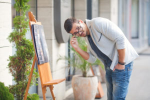 Young Man Reading Menu