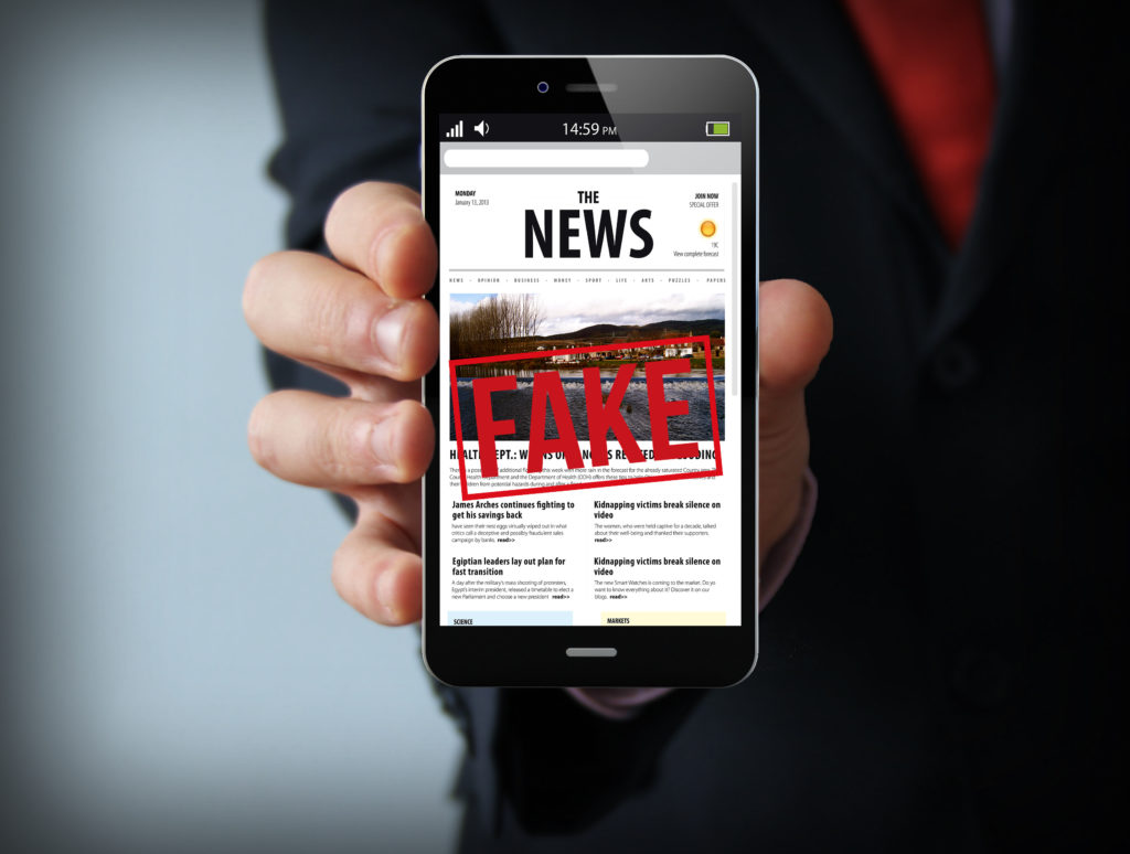 fake news businessman smartphone