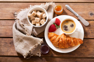 breakfast with croissants and coffee, top view