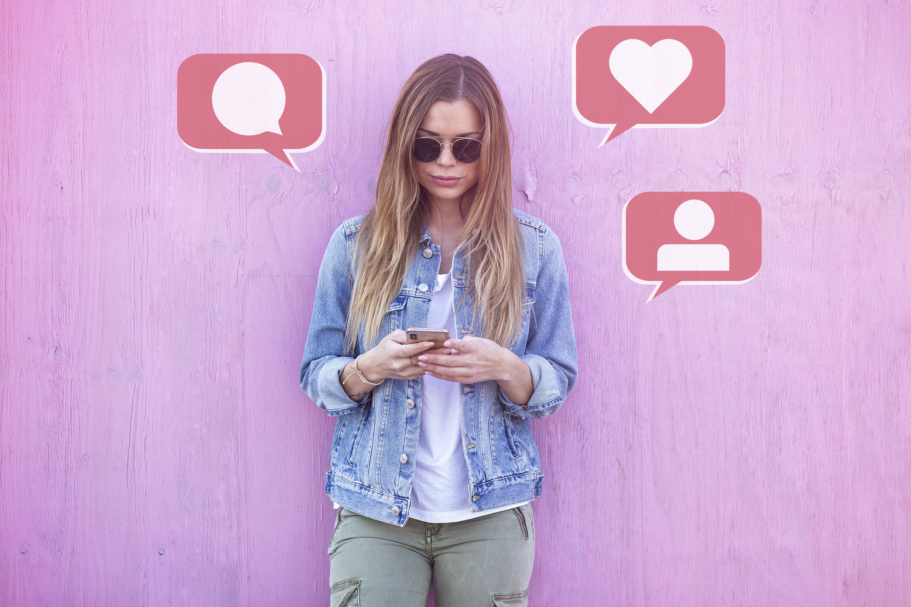 Beauty Girl Influencer Using Social Media on Smartphone with Like, Comment, Follower icon Around on Pink Background