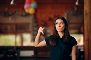 Upset Customer Showing Thumbs Down In a Restaurant ristoranti