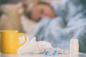 Mature woman suffering from coronavirus, flu or cold