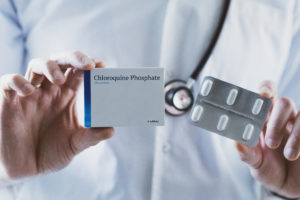 Doctor holding Chloroquine Phosphate drug