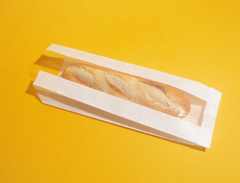 Baguette in un sacchetto di carta