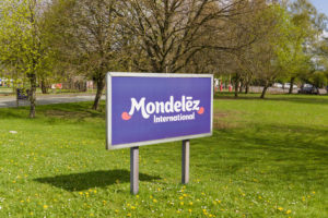 Mondelēz International sign outside the cocoa bean processing factory where chocolate is made in the UK