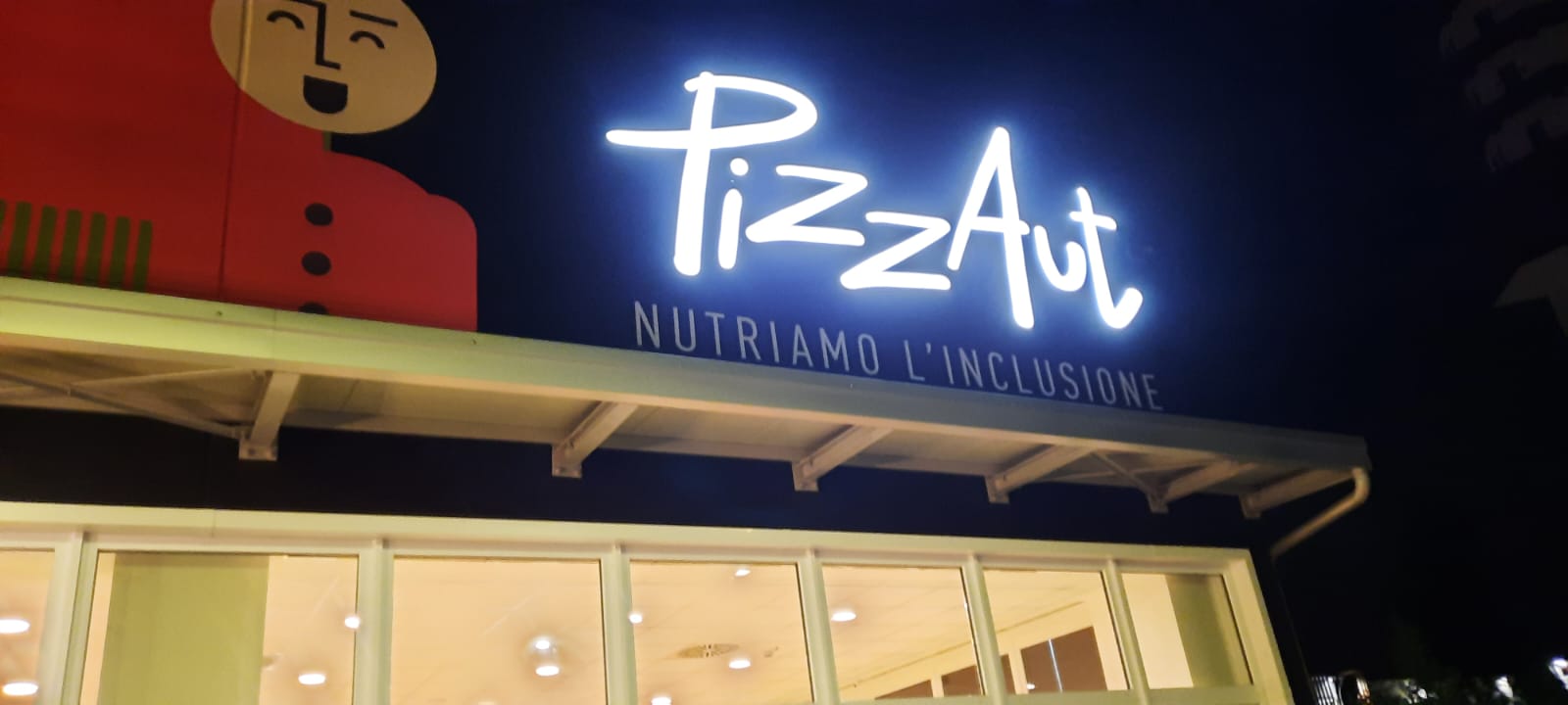 PizzAut, insegna iluminata
