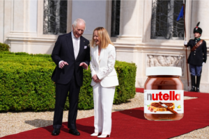 Copertina Meloni Re Carlo e Nutella